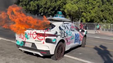 Defenseless Waymo cars have been vandalised and set on fire in the LA protests