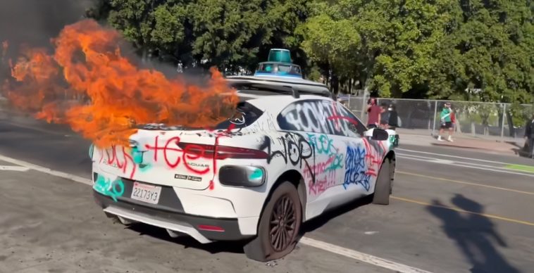 Defenseless Waymo cars have been vandalised and set on fire in the LA protests