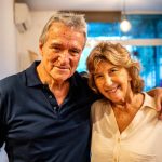 My wife and I are in our late 60s. Do I sell stocks to pay our $30,000 credit-card debt — or do it gradually over 3 years?