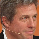 Hugh Grant Steals the Spotlight at Wimbledon 2025 with Effortless Charm and Classic Style