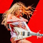 Metal guitars have officially gone mainstream – as pop star Kesha is the latest to don a Jackson Rhoads model