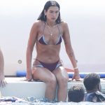 Bikini-clad Dua Lipa flaunts shredded abs during paddleboard yoga in Ibiza