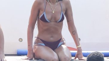 Bikini-clad Dua Lipa flaunts shredded abs during paddleboard yoga in Ibiza