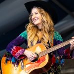 “He has this really old black acoustic that everybody has signed. It’s got Johnny Cash’s name scratched into it, and he had me sign it”: How a rite of passage led Margo Price to etching her signature onto a guitar next to a country legend’s