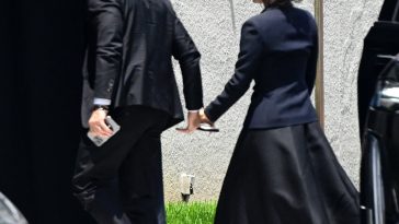 Jeff Bezos gets support from Lauren Sanchez as they arrive hand-in-hand at his mom’s funeral