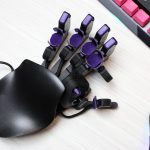 I got this crazy cyborg keypad to improve at PC games. I still suck