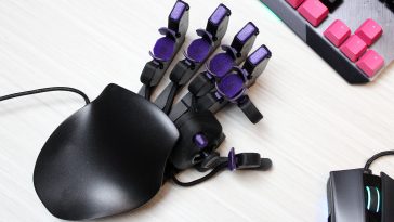 I got this crazy cyborg keypad to improve at PC games. I still suck