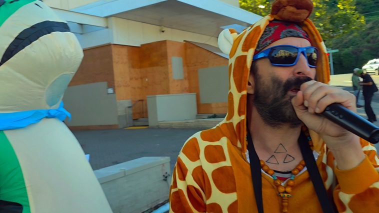 Comedian Arrested in Giraffe Suit Says ICE Laughed at His Trump-Epstein Jokes