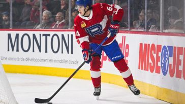 David Reinbacher scores in front of several NHL scouts