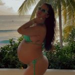 Rihanna drapes her baby bump in jewelry in never-before-seen pregnancy photo